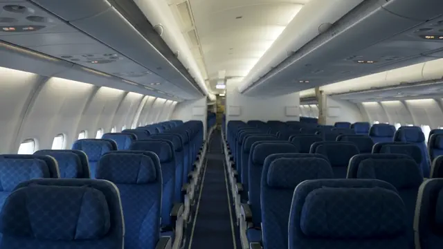 The economy cabin aisle, prepared for boarding.